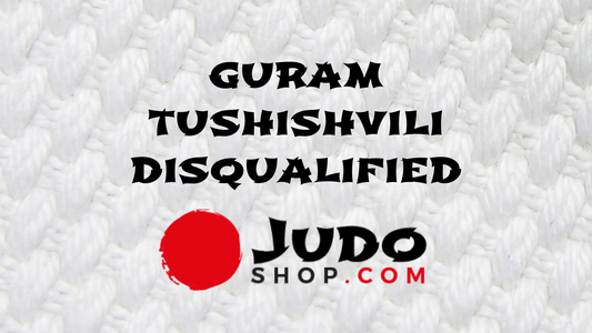 Guram Tushishvili Disqualified - JudoShop.com logo on textured white background.