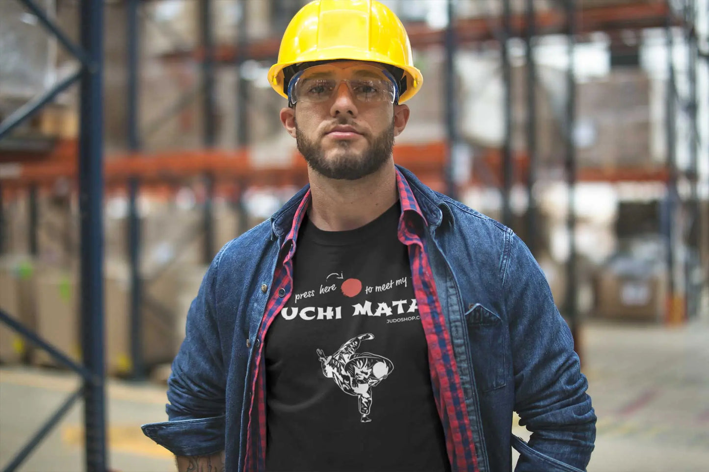 Warehouse worker in safety gear wearing a black Judo T-Shirt with 'Press here to meet my Uchi Mata' design, casual and practical.