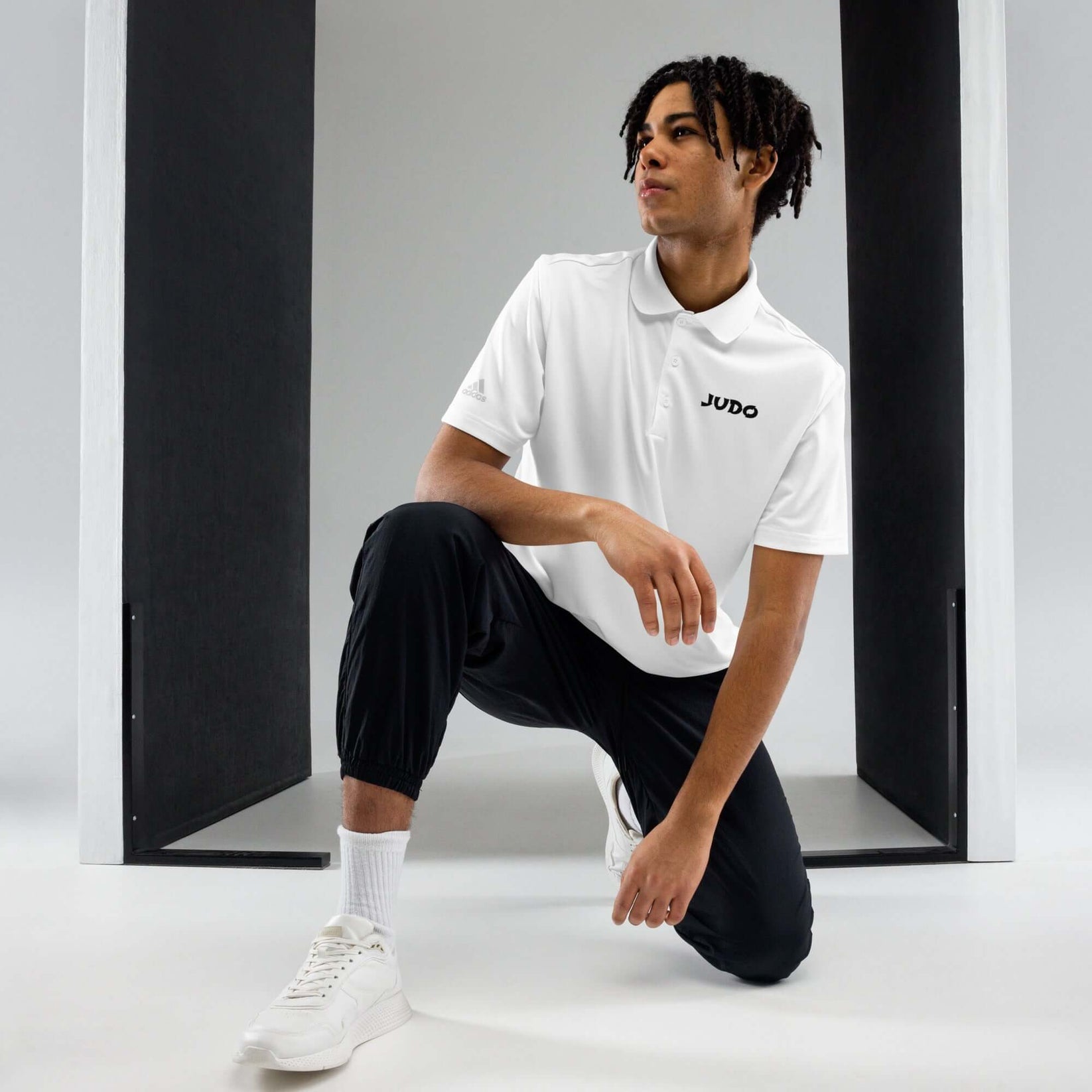 Adidas Judo Polo T-shirt front view showing minimalist JUDO text on white polo